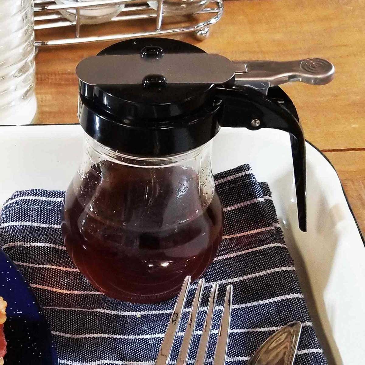 Tablecraft Teardrop Glass Syrup Dispenser with Black ABS Top, 6 Ounce Capacity -- 12 per case