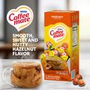 Coffee-Mate Hazelnut Liquid Creamer - 50/0.375 oz. cups per box, 4 boxes per case